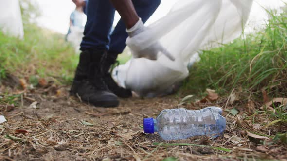 African American man volunteering during river clean-up day