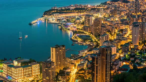 Coastal City With Densely Built-Up Area at Dusk, Night Illumination, Time Lapse