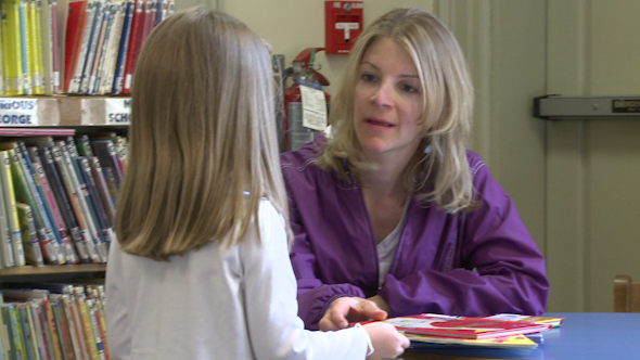 A Child Getting Books For Her Mother To Read To Her (2 Of 3)