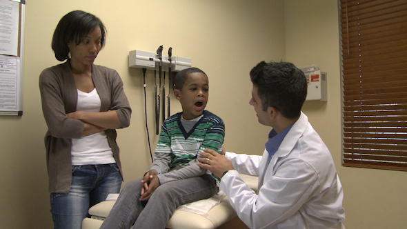 Doctor Diagnoses A Young Boy (6 Of 10)