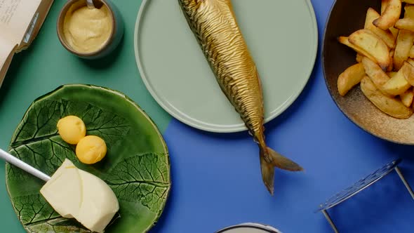 Vertical Flat Lay Video Chef Puts Plate with Crispy Potato Wedges to the Products on the Table