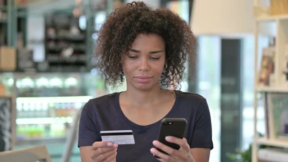Portrait of Online Payment on Smartphone By African Woman
