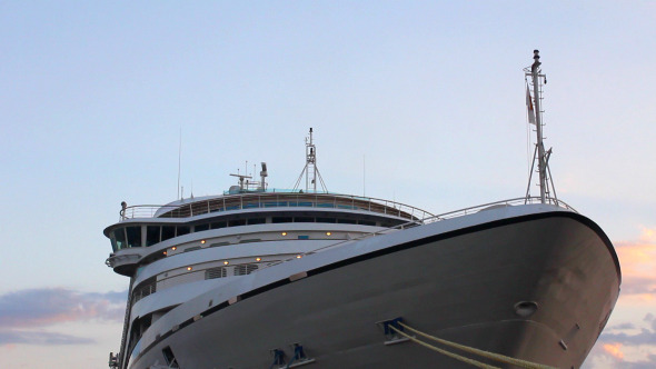 Luxury Cruise Ship Docked in the Port at Sunset 