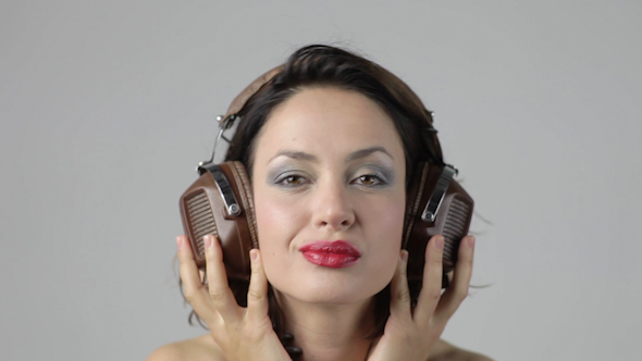 Young Woman Dances And Poses With Headphones 8