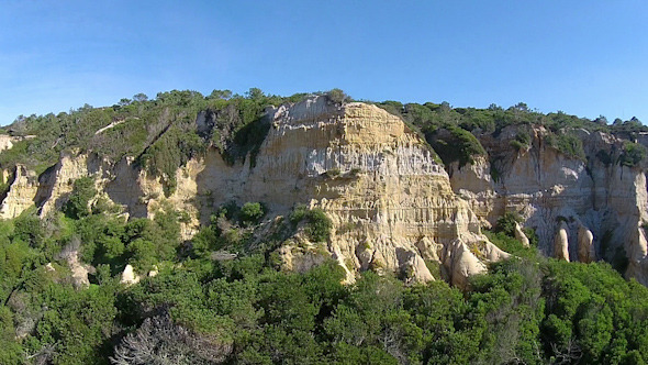 Aerial View Flying down a Sandstone Hill