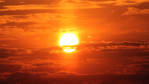 Dramatic Red Sunrise On Dark Cloudy Sky