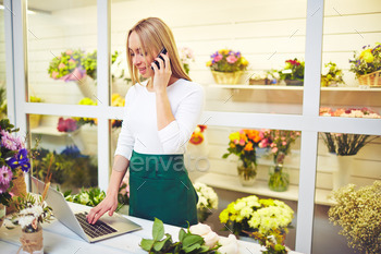 ing laptop in flower shop