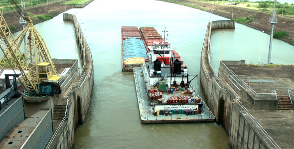 Ship Sailing Away From River Dam