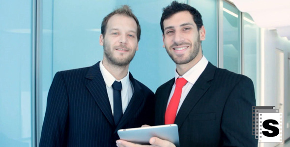 Two Businessman Working With Tablet And Smile