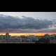 Time-lapse of passing clouds at sunset over city - VideoHive Item for Sale