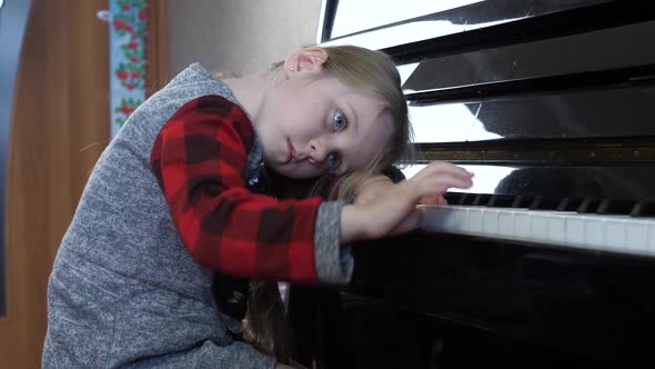 Young 5 Year Old Girl Bored Study Playing the Piano