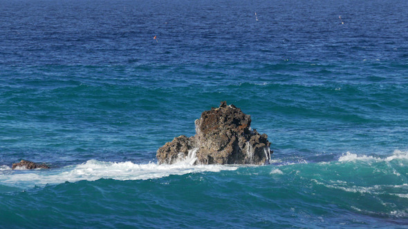 Waves Crashing on Stone Beach