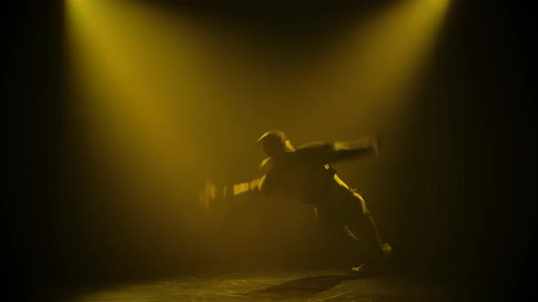 Street Style of Dance Break Dance. The Guy Performs Complex Movements While Standing on His Hands