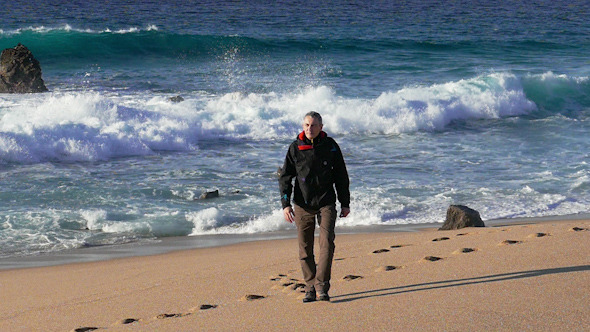 Man Walking on Beach 