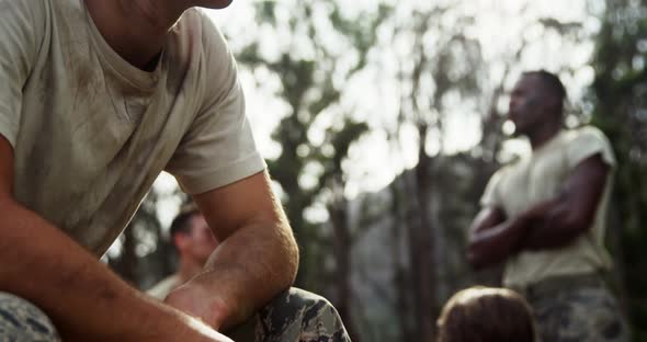 Military soldier relaxing at boot camp