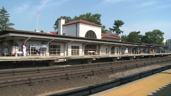 Train Coming Through Small Station