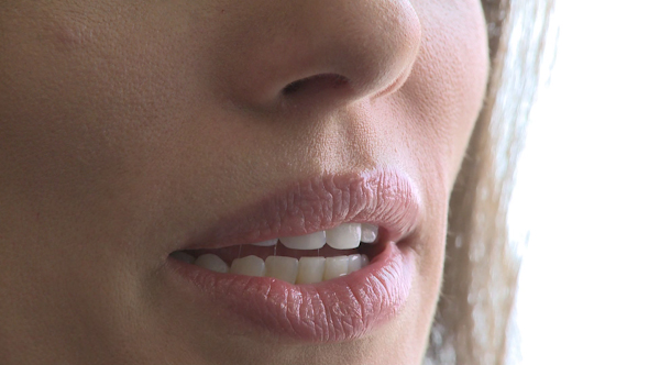 Closeup Of Woman's Mouth As She Converses (1 Of 3)