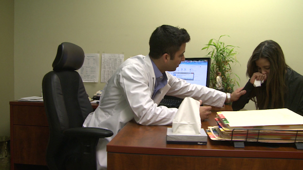 Doctor Comforts Distressed Patient