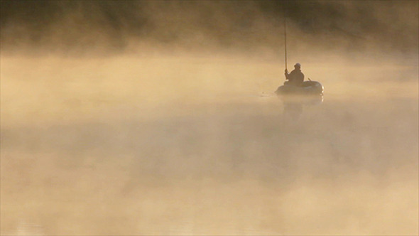Morning Fishing On River In Fog