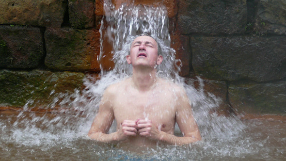 Man Taking Bath in Hot Springs