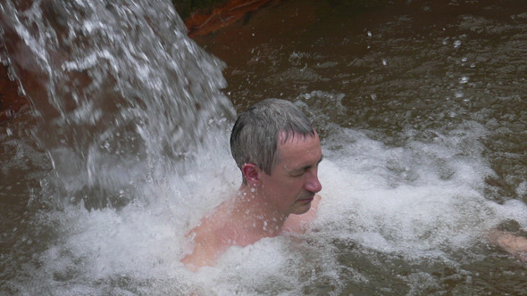 Man Taking Bath in Hot Springs