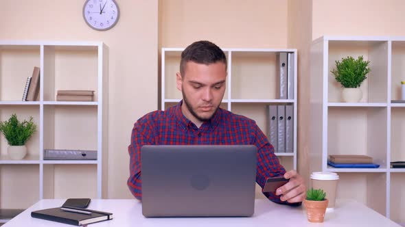 Handsome Businessman Paying Bills