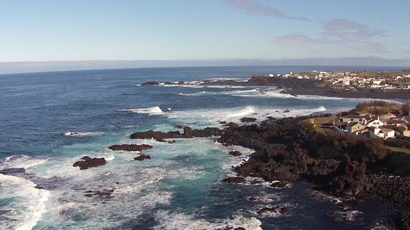 Flying over the Rocks and Ocean Waves