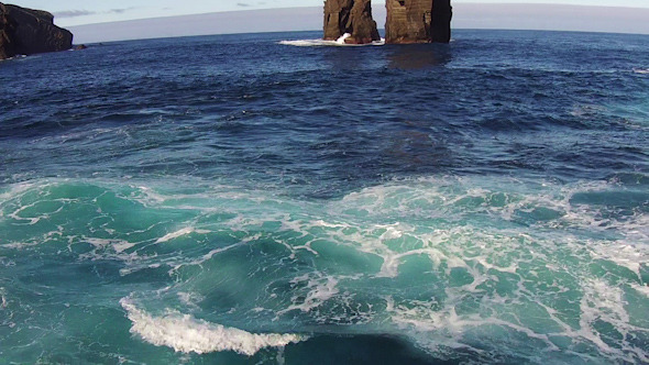 Flying over the High Cliffs and Ocean Waves