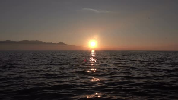 Foggy Mountains And Ocean In Sunset alt