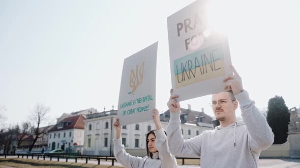 Young People with Raised Posters Calling to Stop the War in Ukraine