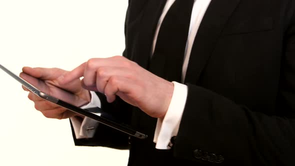 Businessman Working with Tablet PC on White