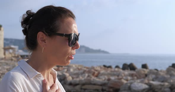 Woman with Deep Breath on Beach