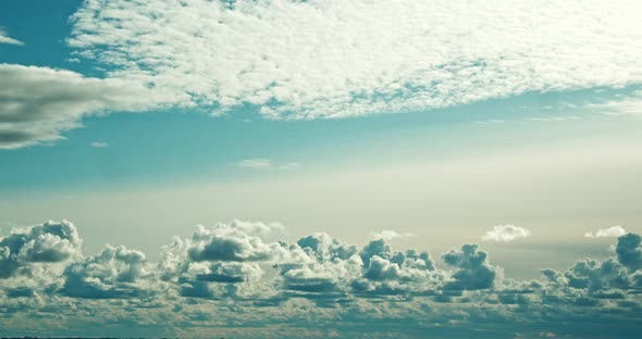 a Timelapse of Floating Clouds in a Clear Blue Sunny Sky