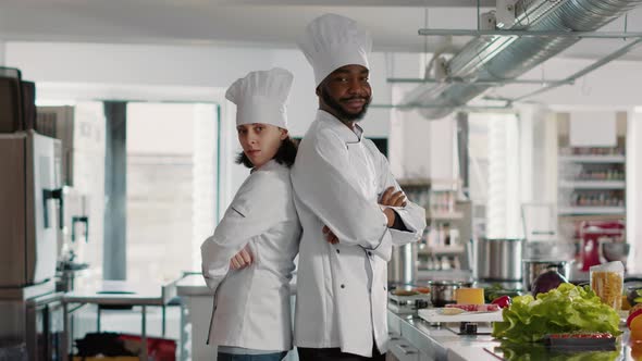 Portrait of Man and Woman Chefs Working on Gourmet Cuisine