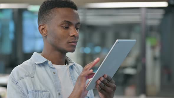 African Man Using Digital Tablet