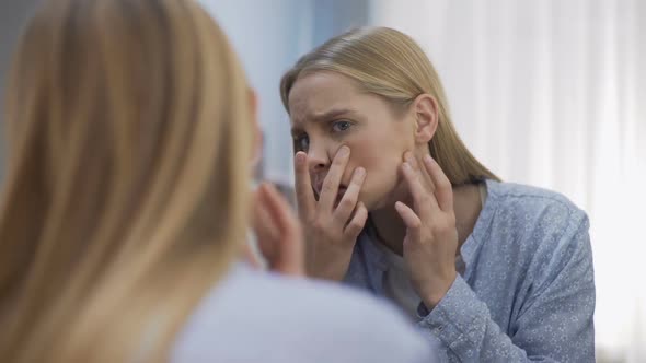 Female Student Looking Sadly at Face Reflection in Mirror Young Age Difficulties