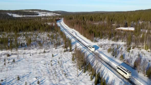 Aerial view of vehicle driving a road in the forest, Overtornea, Sweden.