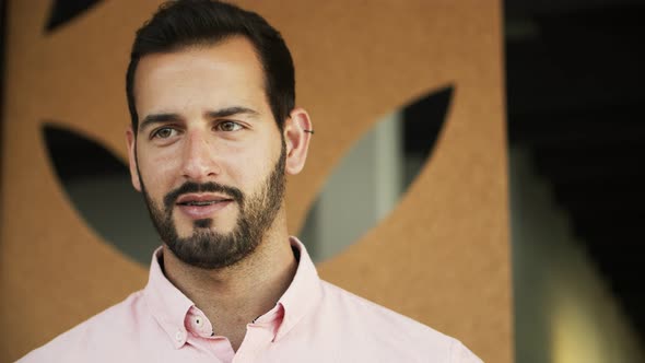 Front View of Handsome Young Man Talking