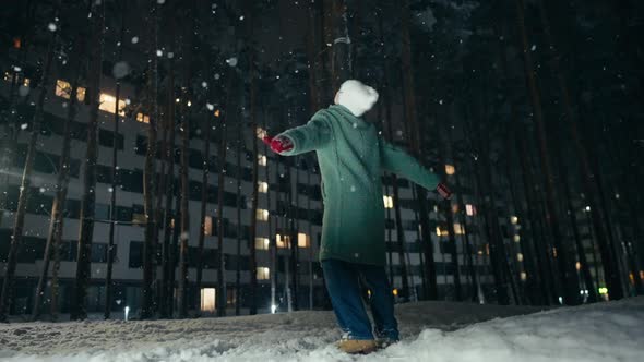 Mother and Son Playing at Winter Festival Snowing