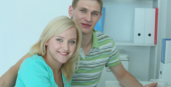 Young Couple In Front Of Computer