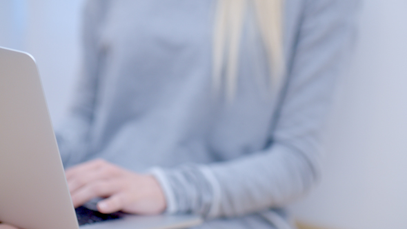 Blurred Woman Using Her Laptop Computer 3