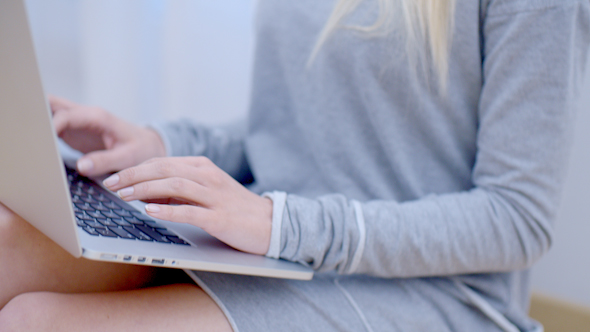 Blurred Woman Using Her Laptop Computer 4