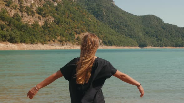 Young Woman Tourist Practicing Yoga in the Nature, Female Happiness, Caucasian Woman Is Practicing