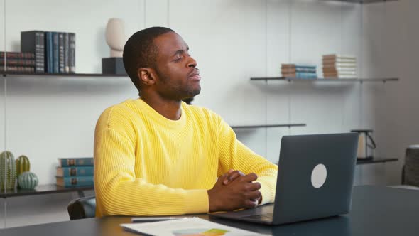 Young man thinking about a new idea for your business. Thinking young male at the desk