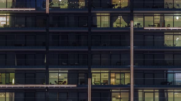 Flat Night Panorama of Multicolor Light in Windows of Multistory Buildings Aerial Timelapse