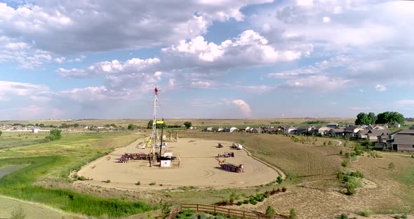 A drone shot illustrates the proximity of oil and gas drilling to the lives of everyday Colorado cit