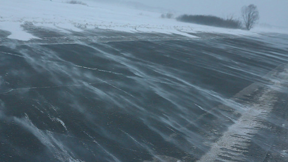 Cars On Winter Road At Blizzard alt