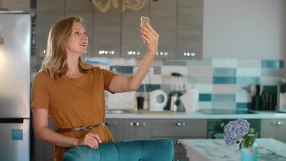 Midlife Woman Looking in Frontal Camera Making Selfie Photo Rbbro