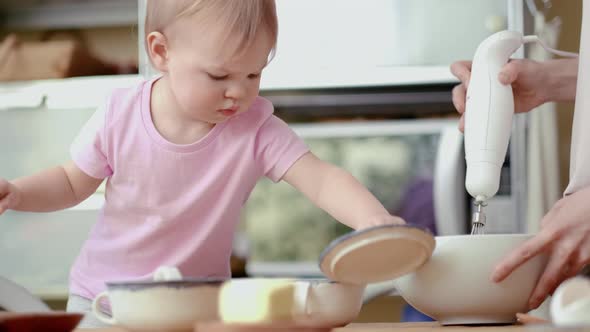 Little Cute Funny Girl Helping Mother Prepare Pie Cake in Kitchen Baking Homemade Cookie Together