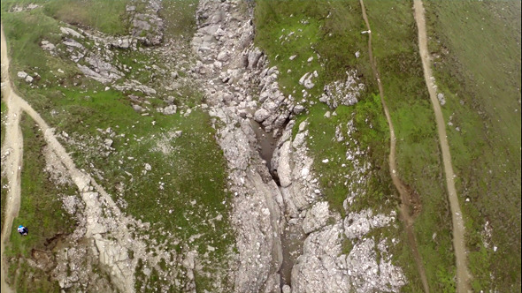 People in a Rocky Trail